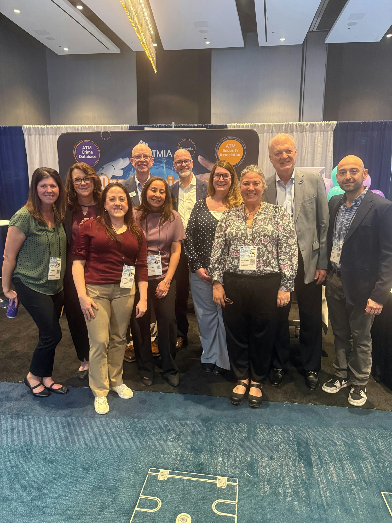 Staff volunteering at training expo. This is a mix of Leadership team and staff.