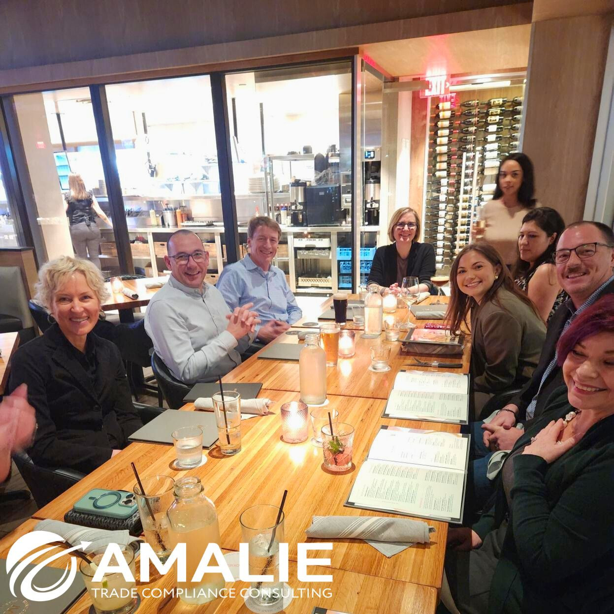 Amalie team members sit down to connect during a dinner, we cherish in-person meetings as a fully remote company.