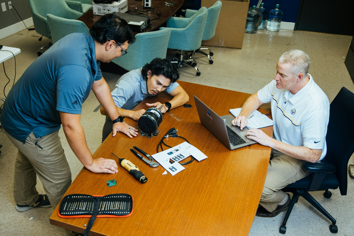 Motor sales team and motor design engineers working through proprietary products