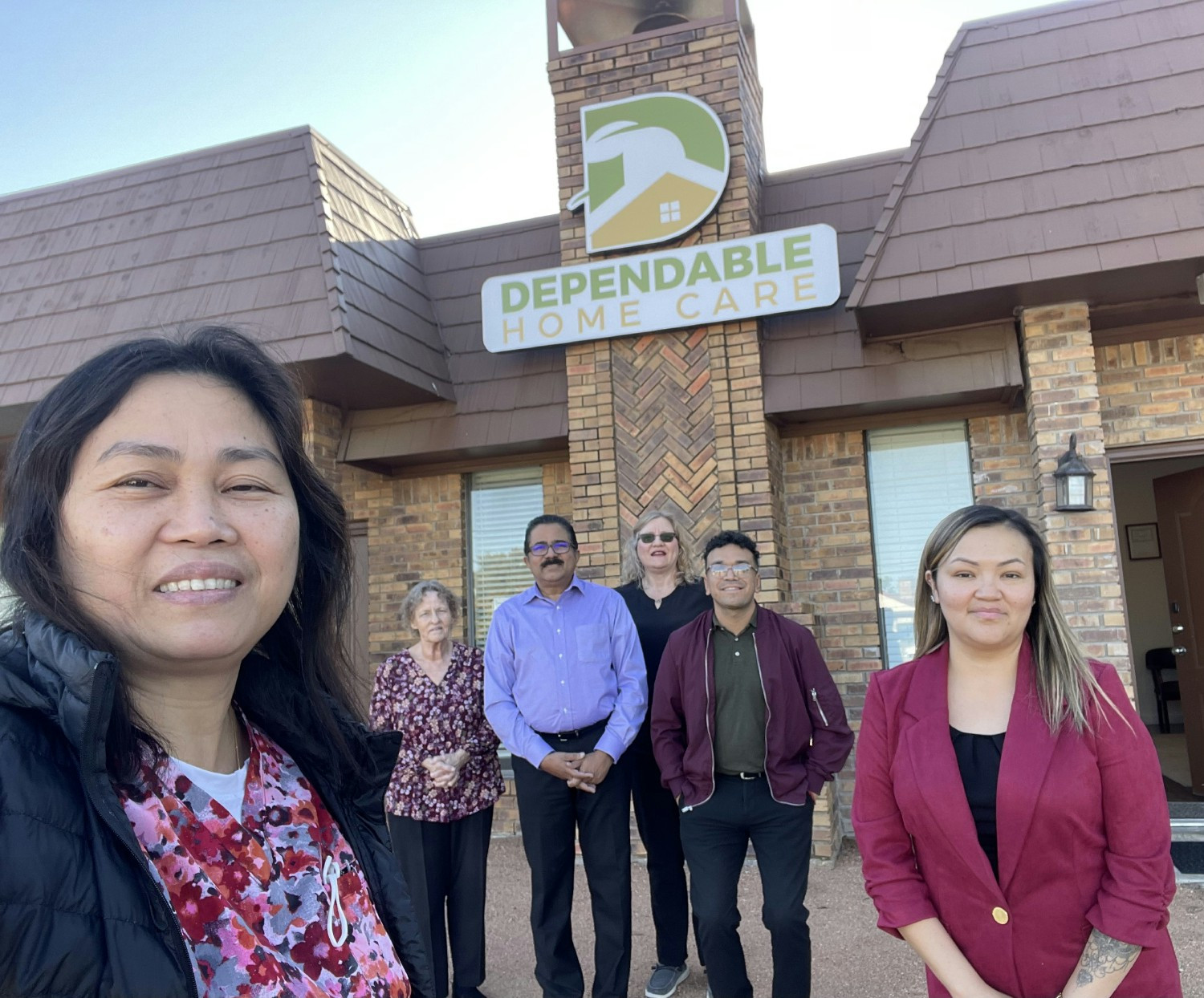 Office staff in front of the office.