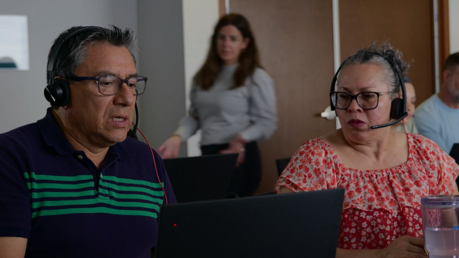 E4E Relief colleagues working closely together during a high‑volume period.