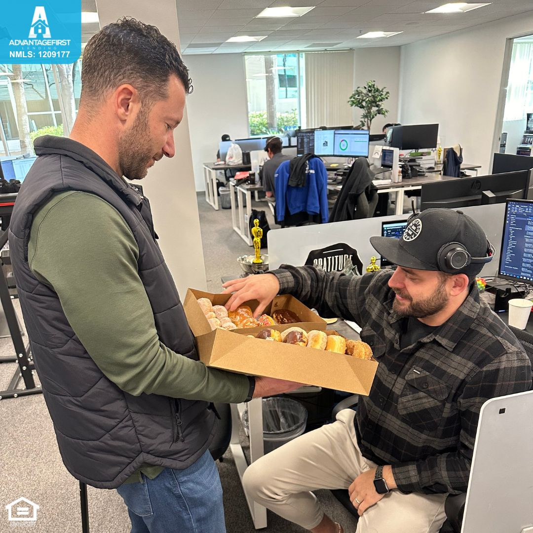 CEO, Kurt handing out donuts to the team