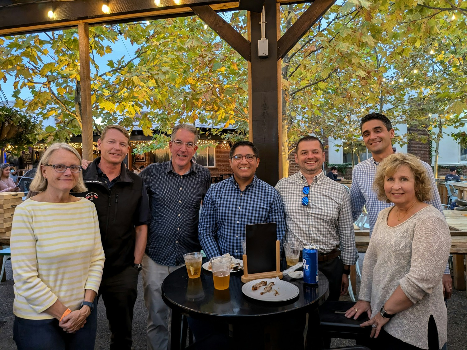 Employees gathered for a summer celebration to relax, connect, and enjoy time together outside of the office.