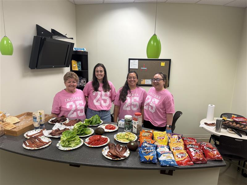 NPCA teammates prepare lunch for the staff on 
