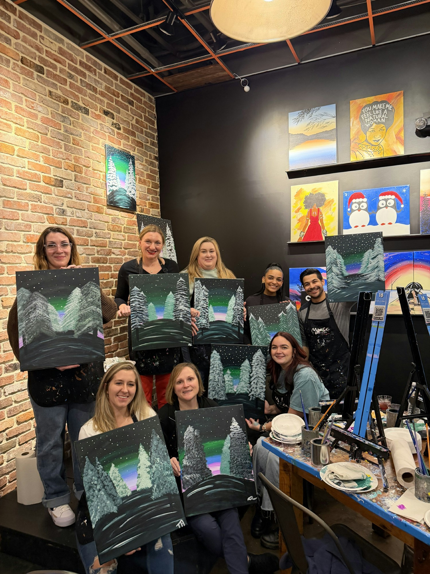 Local Infusion employees take a painting class together.