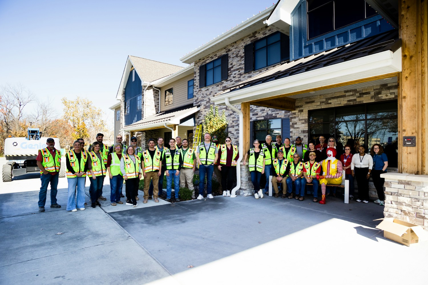 Volunteer day to hang holiday lights on the Ronald McDonald House through our Coil Cares program.