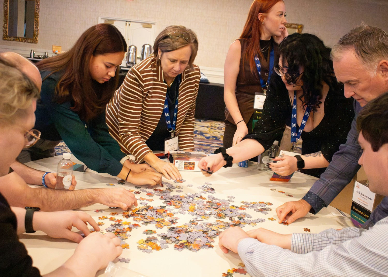 Employees completing a puzzle challenge at the Gravis Law annual retreat