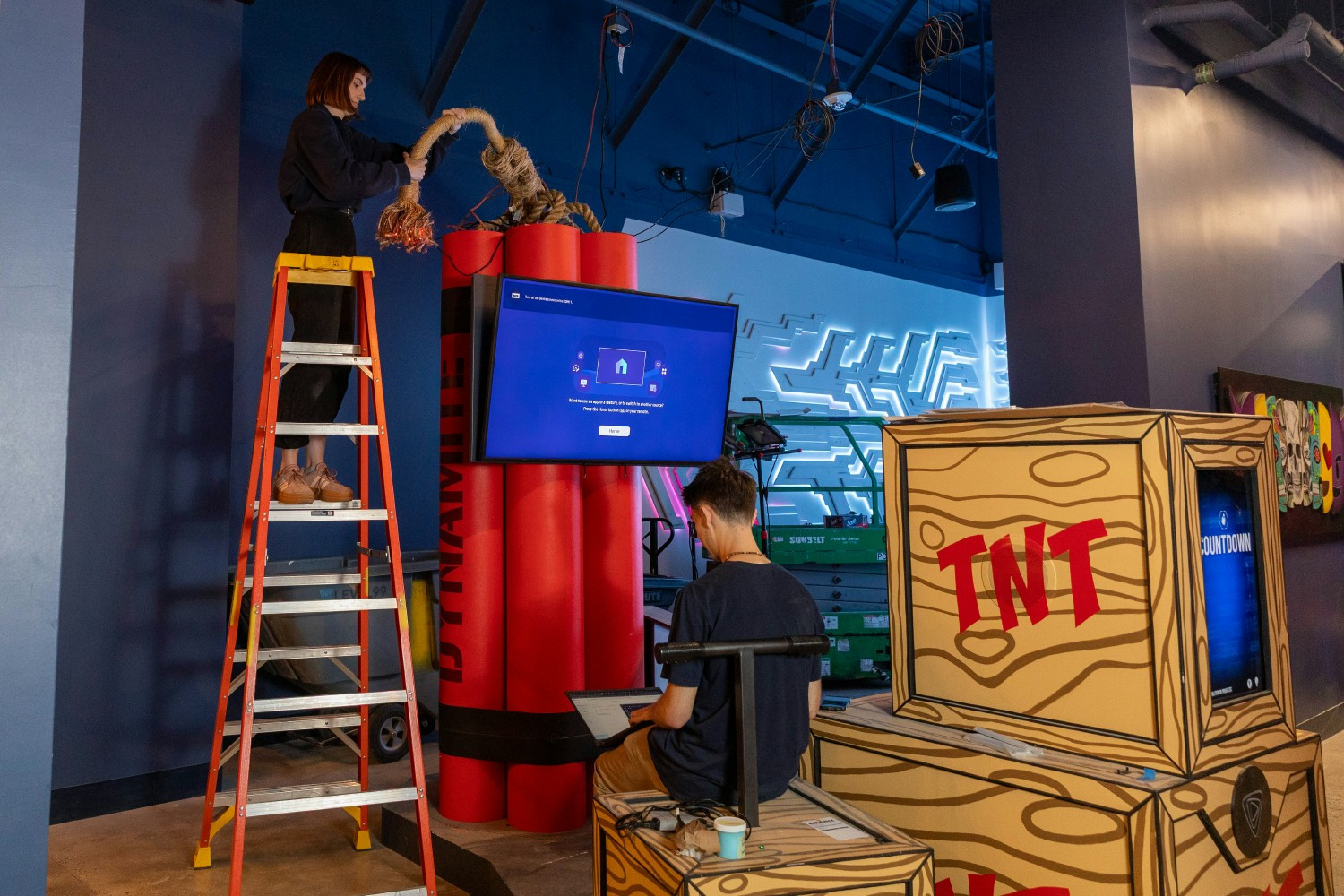 Two of our team members installing and putting the finishing touches on one of our signature Player-vs-Player duels!