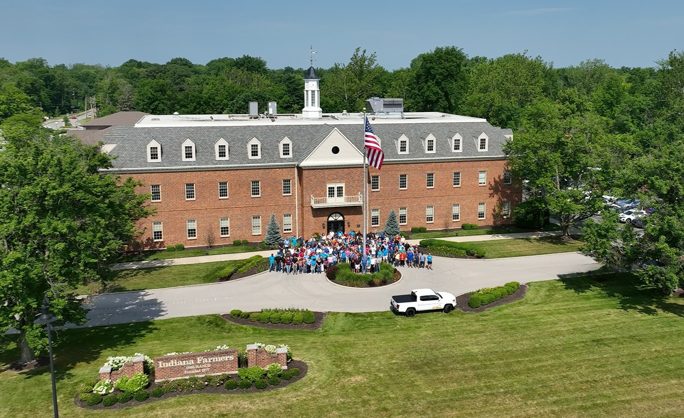 Associates gather in front of the Indiana Farmers Insurance home office during an associate celebration event.