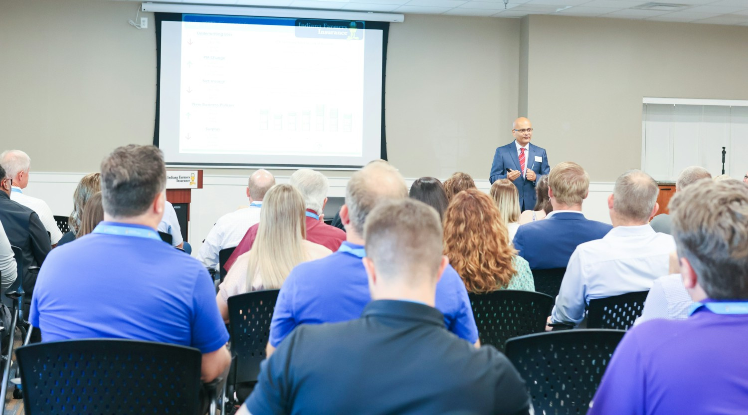 Yogesh Deshmukh, CFO & Treasurer of Indiana Farmers Insurance, addresses independent agents during an Agency Open House.