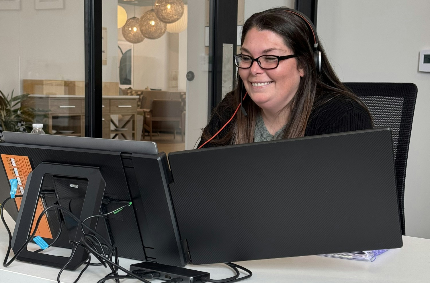 Indiana Farmers Insurance Partner Service Team Client Advocate Tamara Maines assists a small business customer by phone.