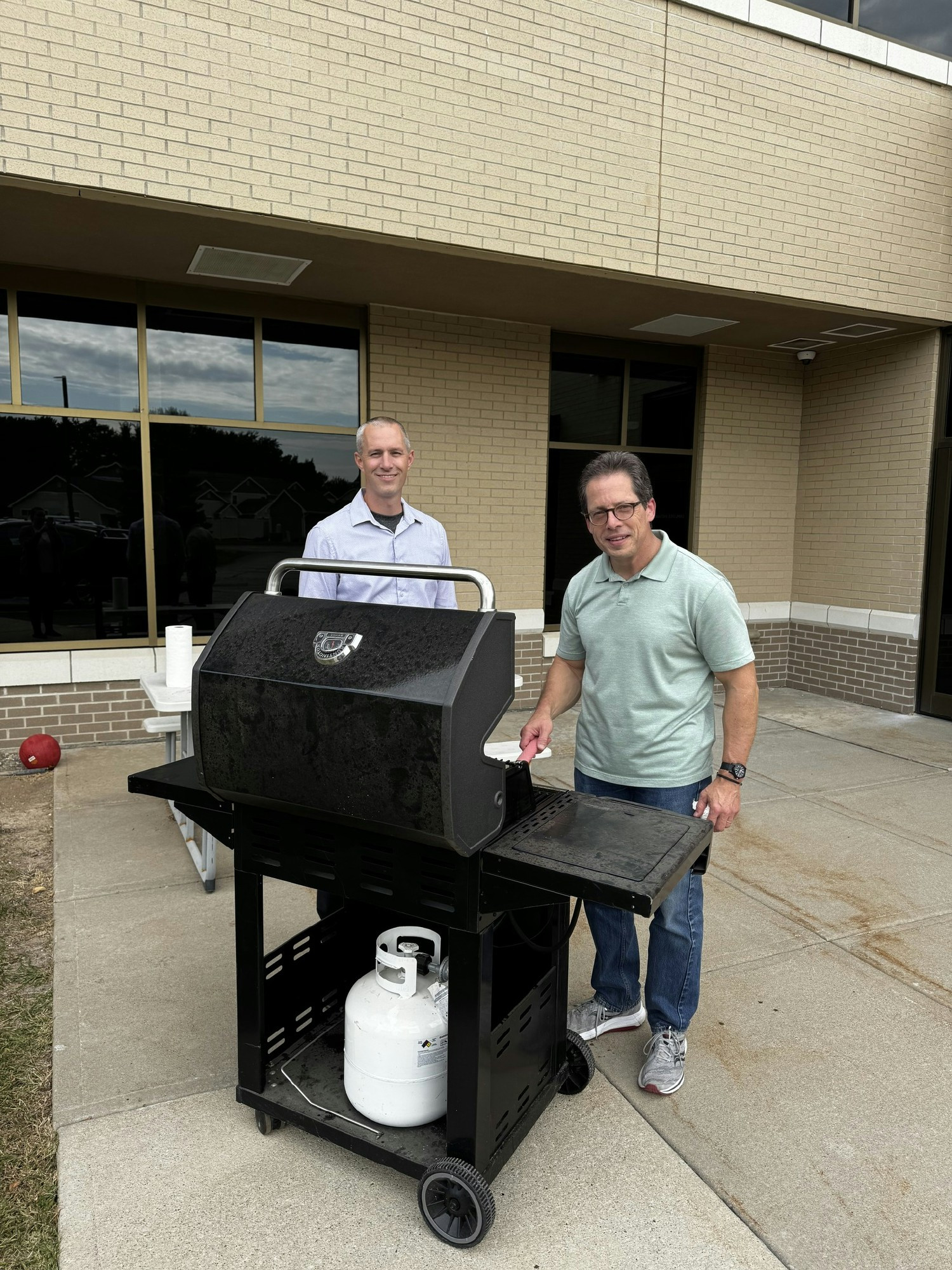 Team members grilling out for an office food day!