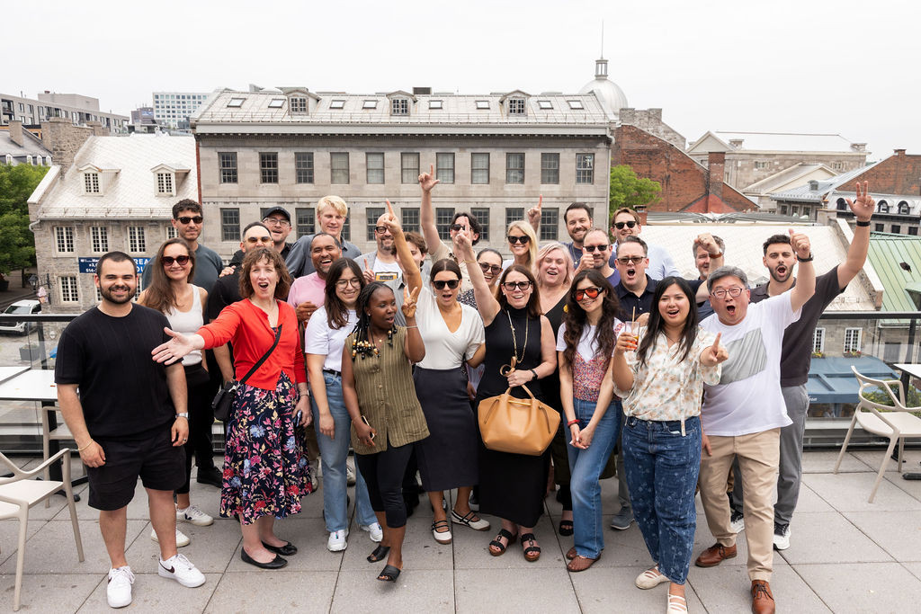 Team members enjoying time together outside the office at our annual BBQ