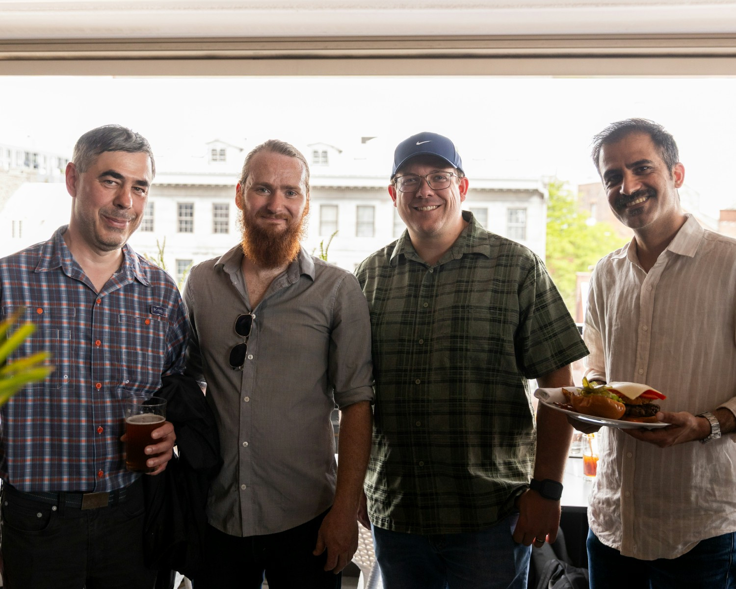 Team members enjoying a casual moment together during a company celebration.
