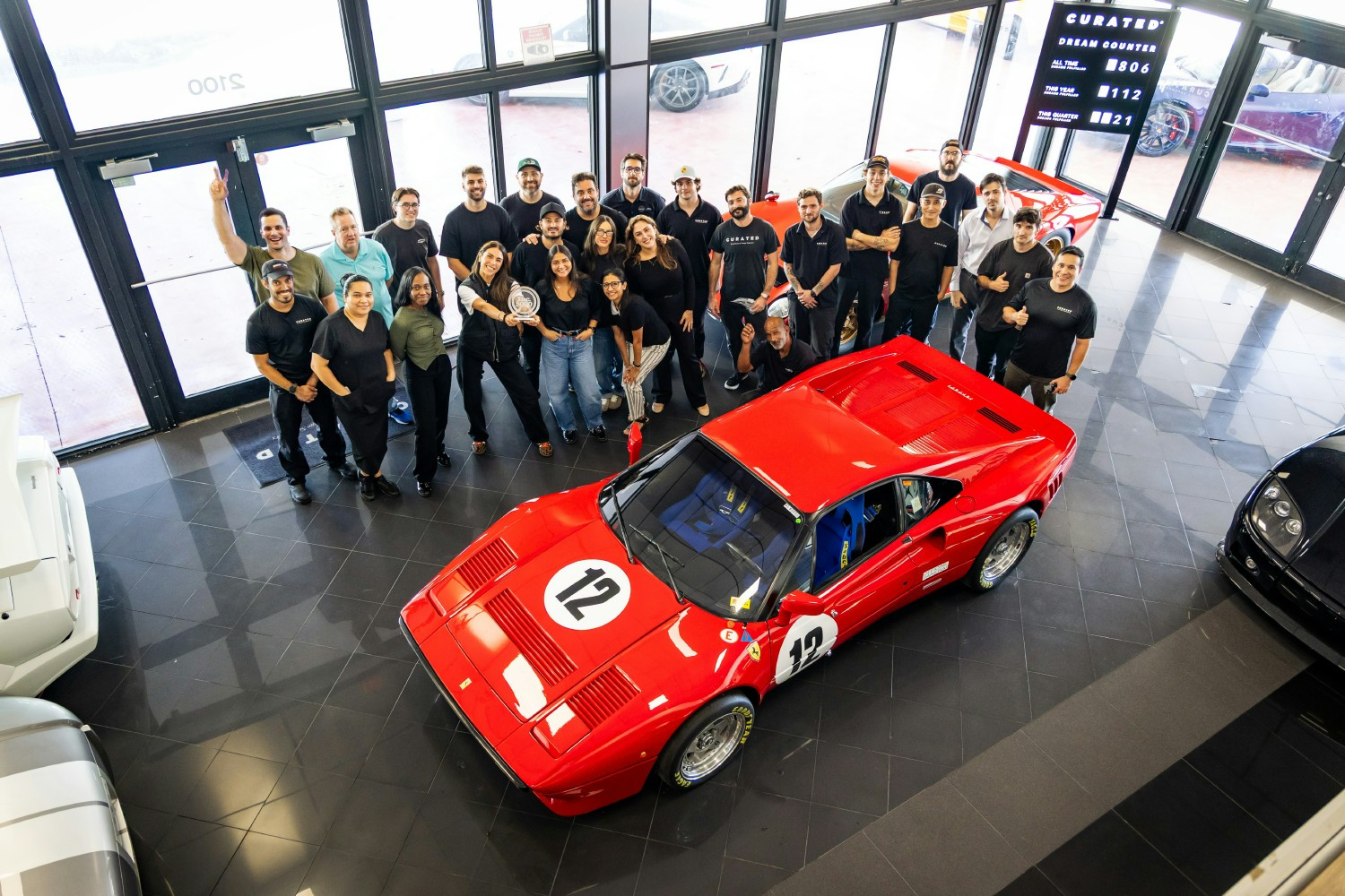The whole crew gathered together to celebrate a company win