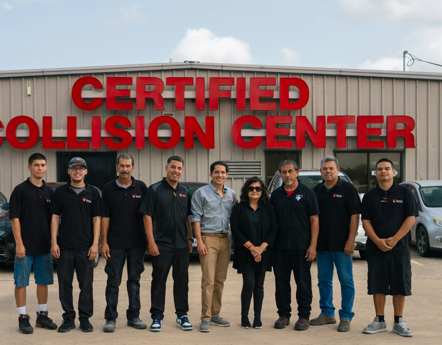 Auto Collision team celebrating their new certification status. 