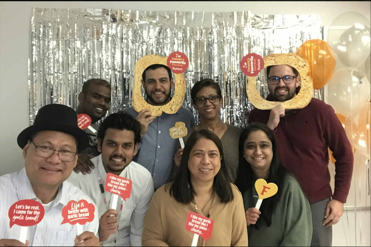 Colleagues not taking themselves too seriously at a marketing campaign launch event.
