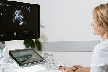 doctor reviews ultrasound monitor