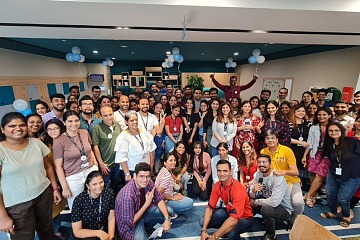 The 2022 best workplaces in Asia, is depicted with employees at shipping company Maersk gather for a group photo.